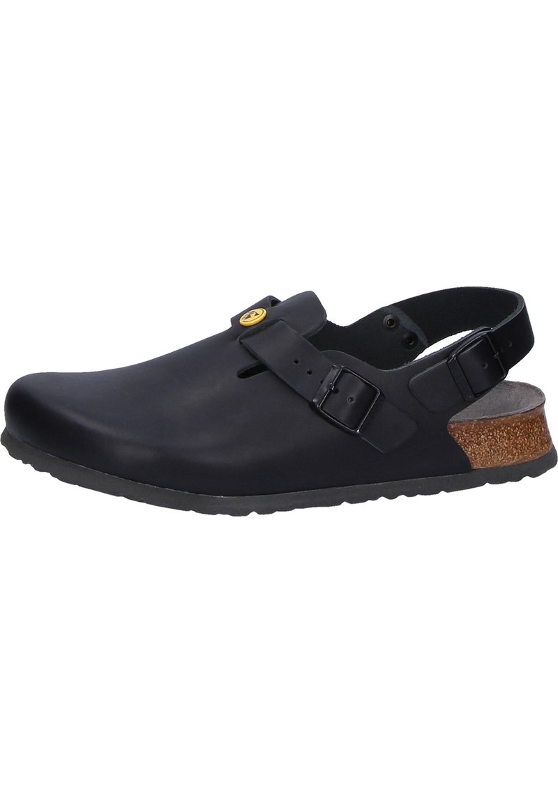 Black closed-toe clog made of rubber with an adjustable strap, textured sole, and cork accent on the heel. Non-slip design.