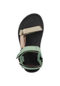 Teva sandal featuring a black rubber sole, light green and beige straps, adjustable design, and textured footbed for grip.