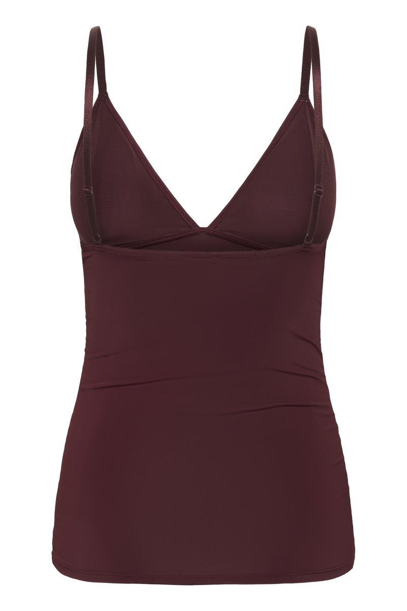Bordeaux tanktop met verstelbare dunne bandjes, voorzien van een V-hals en criss-cross achterkant. Gemaakt van soepel, rekbaar materiaal.