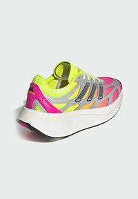 Gray and neon yellow athletic shoe with pink accents, designed with a mesh upper, thick white sole, and black rubber outsole.