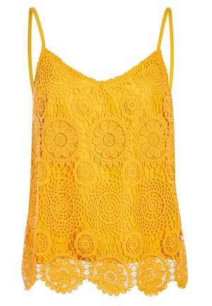 Haut jaune à fines bretelles avec superposition en dentelle crochetée florale circulaire et ourlet festonné.