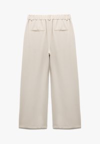 Beige wijdbeenbroek met een elastische tailleband, twee achterzakken, een zachte textuur en een recht gesneden ontwerp.