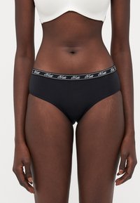 Black cotton bikini briefs with a soft waistband featuring white embroidered brand logo. Smooth texture and fitted design.
