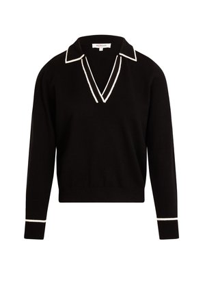 Pull en maille noir avec un col en V et un col blanc contrastant. Présente des bordures blanches sur les manches. Texture douce, coupe décontractée.