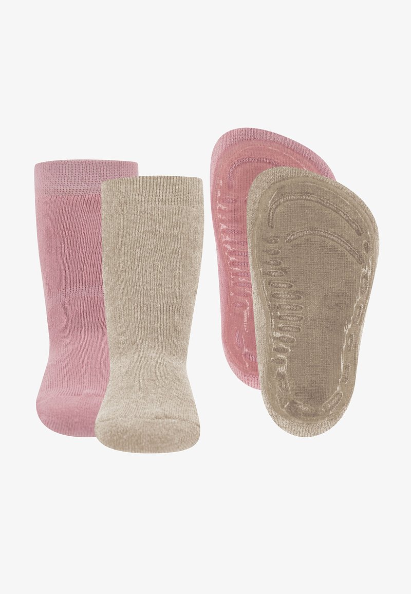 Twee paar antislip babysokken in roze en beige, die zowel de voorkant als de zool met gestructureerde grippatronen tonen.