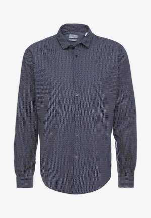 Chemise à manches longues pour homme, boutonnée, avec un motif micro point bleu foncé et blanc, et col classique.