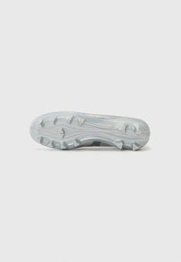 White and gray athletic shoe sole with a textured surface, featuring pronounced lugs for grip and a streamlined design with subtle accents.
