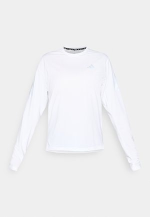 White long-sleeve athletic shirt featuring a round neck, ribbed texture, and reflective accents on the shoulders. "Adidas" logo in light blue.