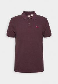 Polo tričko v tmavě burgundské bavlně se třemi knoflíky, krátkými rukávy a mal�ým červeným logem Levi's na levé hrudi.
