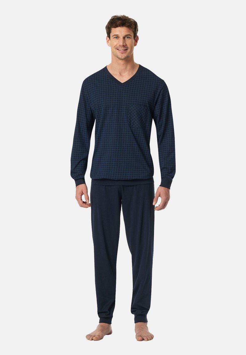 Conjunto de lounge azul-marinho composto por uma blusa de manga longa com decote em V e padrão xadrez, acompanhada de calças de tom sólido com punhos e cintura elástica.