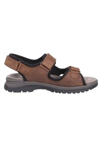 Brown leather sandal with adjustable straps, black cushioned insole, textured grey outsole, open-toe design, and sturdy construction.