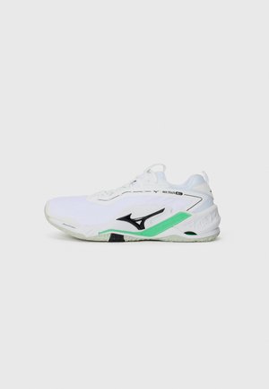 White athletic shoe with black and mint green accents, featuring a textured mesh upper, lace closure, and grooved rubber sole for traction.