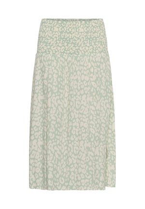 Jupe vert clair avec taille haute froncée et motif léopard blanc irrégulier, longueur genoux, tissu fluide.