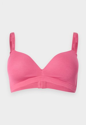 Soutien-gorge sans fil rose doux avec bretelles ajustables, bonnets moulés et bande élastique à logo en bas pour un maintien léger et un confort optimal.