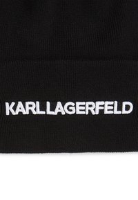 Beanie negru din tricot, cu logo-ul brodat alb "KARL LAGERFELD" pe față. Textură moale, ajustare confortabilă și design simplu.