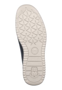 Suola di scarpa con un motivo di battistrada bianco, caratterizzata da una presa testurizzata e un logo circolare sul tallone. Realizzata in materiale gommoso resistente.