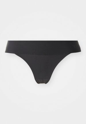 Sorte sømløse kvinders trusser i thongs stil med bred talje, lagt fladt på hvid baggrund.