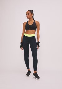 Nike Performance Tights - black/yellow