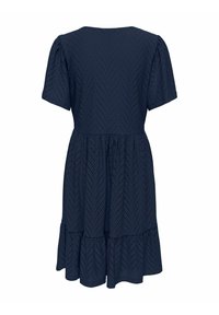 Robe bleu marine longueur genoux avec manches courtes bouffantes, motif œillet en zigzag, taille cintrée et ourlet à volants.