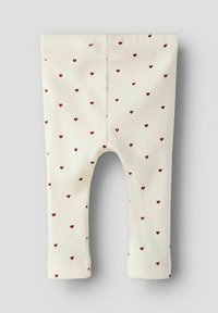 Kremowe legginsy z prążkowaną teksturą, ozdobione małymi czerwonymi serduszkami, prezentujące dopasowany krój i elastyczny pas.