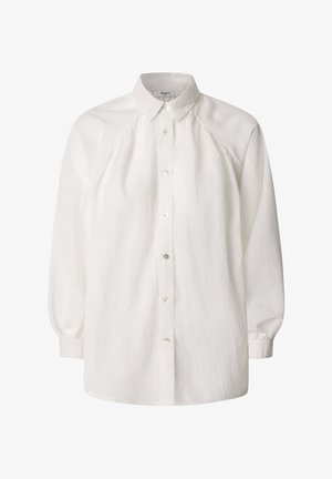 Camisa blanca de botón hecha de una tela texturizada. Presenta un cuello clásico, mangas largas y sutiles líneas verticales. Botones plateados en la parte delantera.