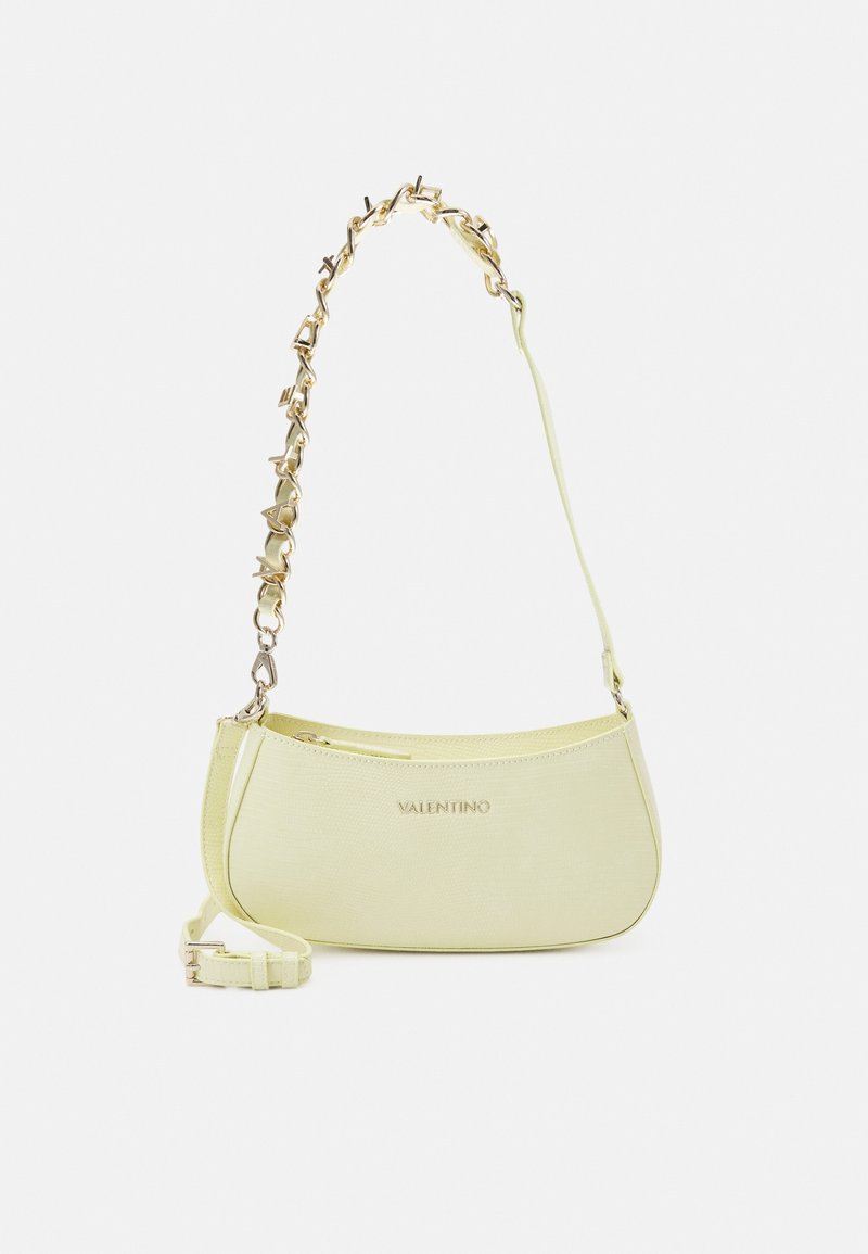 Yellow textured leather handbag with a curved shape, gold-tone chain strap, and a small adjustable shoulder strap. "Valentino" logo is visible.