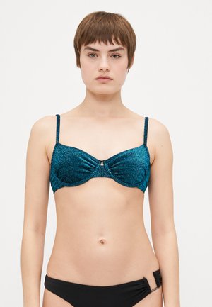 Teal glitter bikini top with underwire, ruched design, and slim adjustable straps, featuring a front fastening accent.