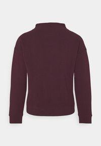 Bordeaux sweatshirt met een textuurstof, lange mouwen, een ronde hals met een lichte hoge kraag, en ribgebreide manchetten en tailleband.