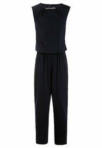 Marinblå overall med ärmlös design, med en insvungen midja, slätt tyg och en diskret detalj vid halsen. Avslappnad men ändå skräddarsydd look.