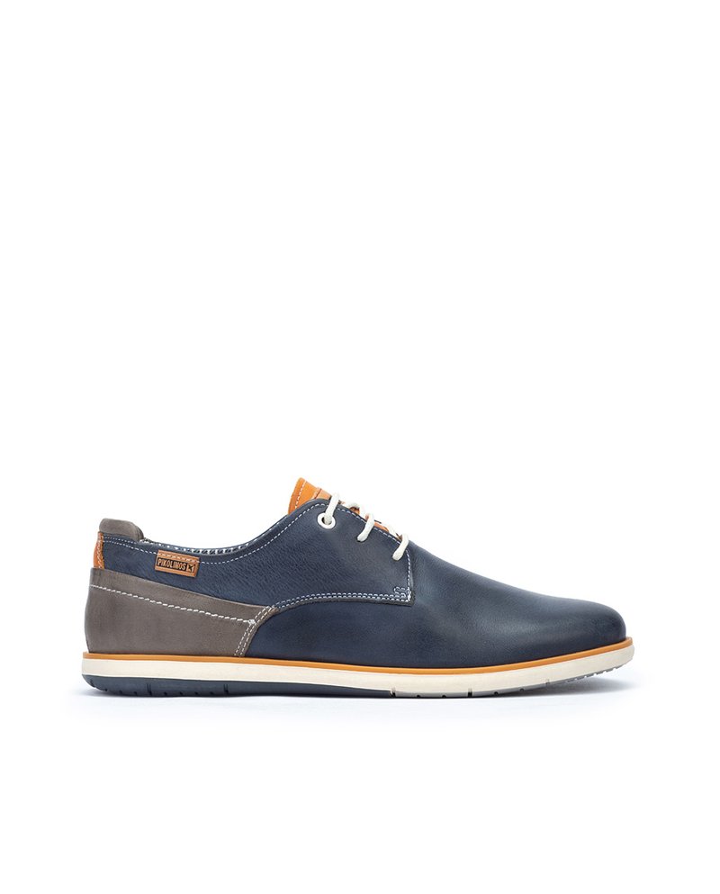 Navy blue leather shoes with a smooth finish, grey accents, orange detailing, and beige sole; features two eyelets and a rounded toe.