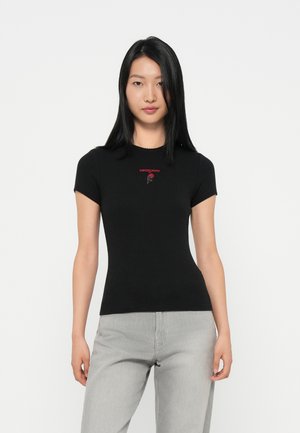 Black fitted t-shirt with short sleeves, featuring red embroidered text and rose design on the chest. Smooth fabric, ribbed texture.