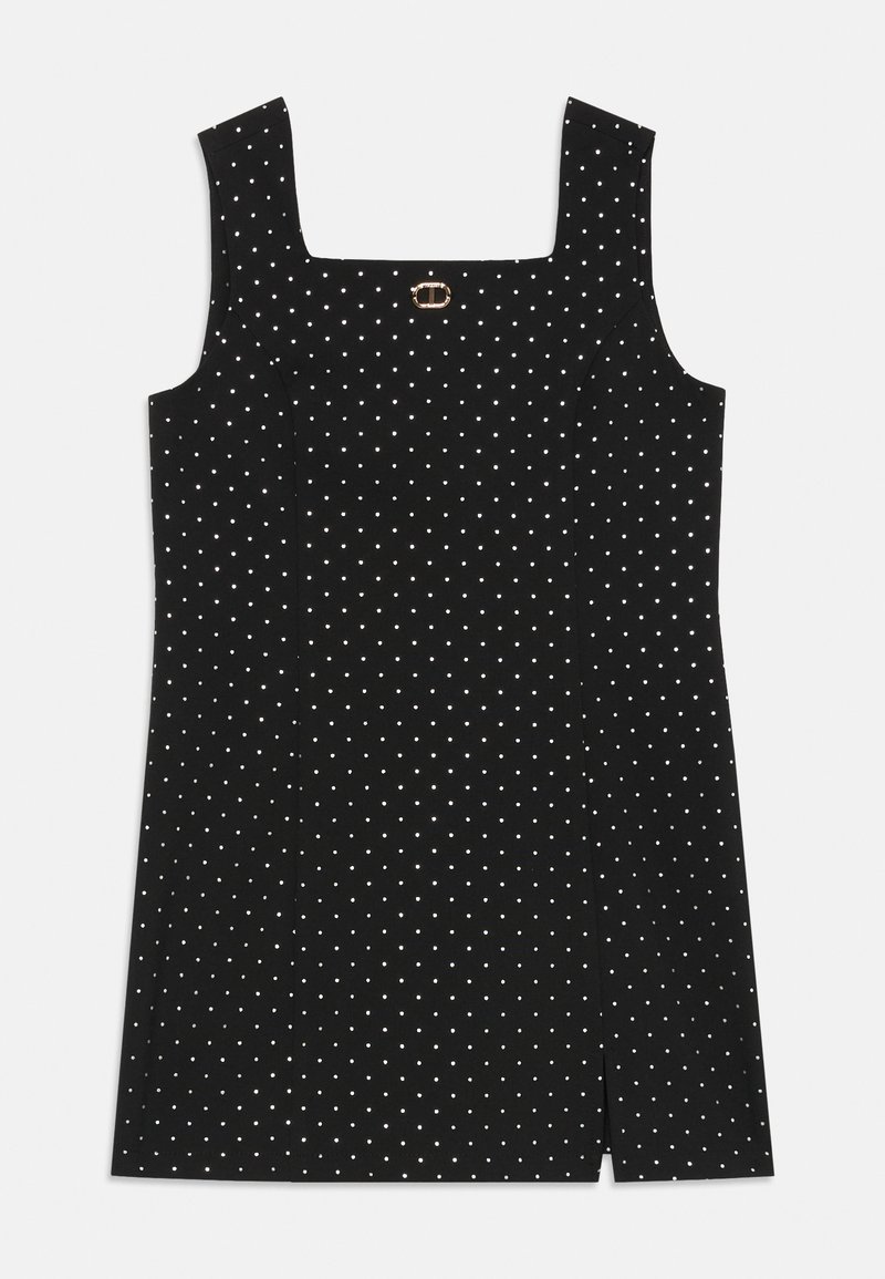 Crna bezrukavna mini haljina s bijelim točkicama, kvadratnim izrezom, laganim prednjim prorezom i malim zlatnim kopčom na prsima.