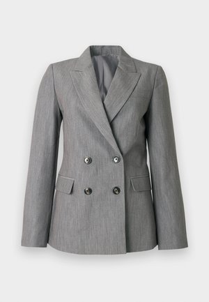 Blazer gris croisé en tissu texturé, avec des revers nets, deux poches avant et des boutons noirs.