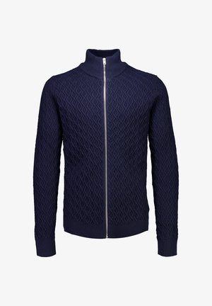 Marineblauwe ritstrui met hoge kraag, voorzien van een gestructureerd ruitpatroon en ribgebreide manchetten en zoom. Gemaakt van een gebreide stof.