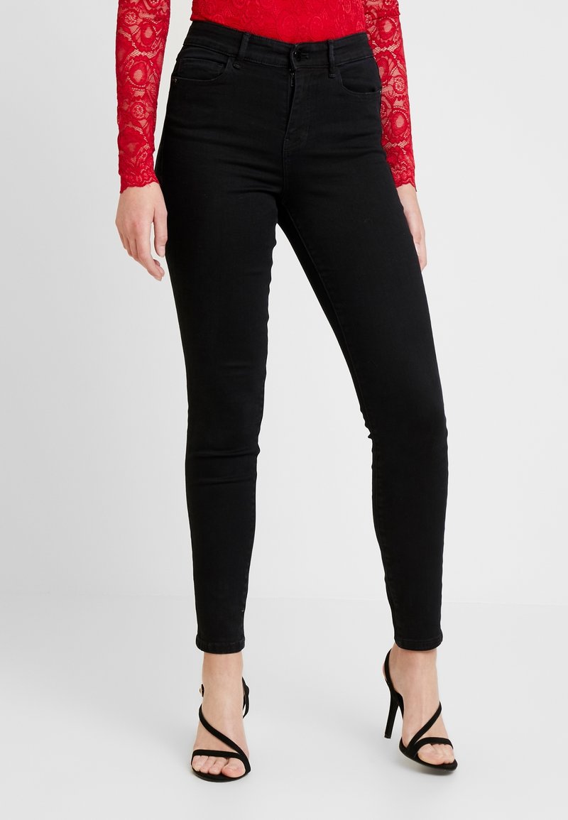 Svarta skinny jeans i denim, med medelhög midja, femficksdesign och smal passform ner till anklarna.