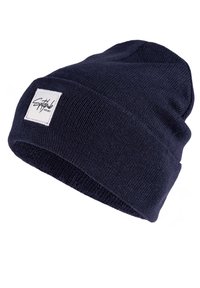 Navy knit beanie with a textured finish, featuring a folded brim and a rectangular brand tag on the side.