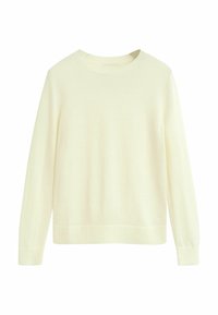 Pull en crème clair en maille douce avec un col rond et des manches longues. Dispose de poignets et d'un ourlet côtelés.