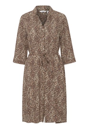 Rudų, kreminių ir tamsiai rudų leopardų rašto suknelė su apykakle, mygtukų priekyje ir juosmens raiščiu. Trys ketvirtadaliai rankovės ir iki kelių ilgio.