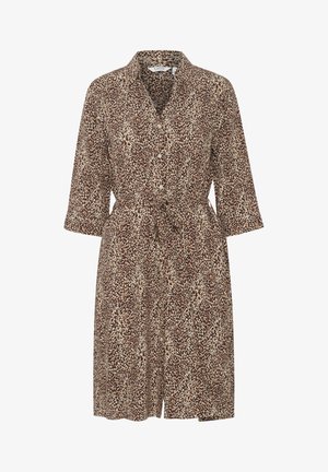 Rudų, kreminių ir tamsiai rudų leopardų rašto suknelė su apykakle, mygtukų priekyje ir juosmens raiščiu. Trys ketvirtadaliai rankovės ir iki kelių ilgio.