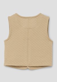 Beige steppweste ohne Ärmel mit rundem Ausschnitt und einer horizontalen Naht auf der Rückseite, gefertigt aus einem weichen, strukturierten Stoff.