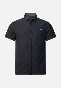 Chemise noire à manches courtes boutonnée, avec une texture verticale subtile, col pointu et petite poche poitrine étiquetée "SEASIDE."