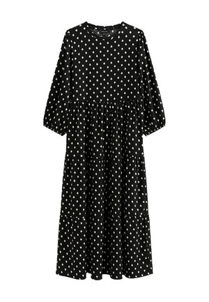 Zwarte jurk met driekwartmouwen, gelaagd ontwerp en wit diamanten patroon overal. Gemaakt van zachte stof met een ronde hals.