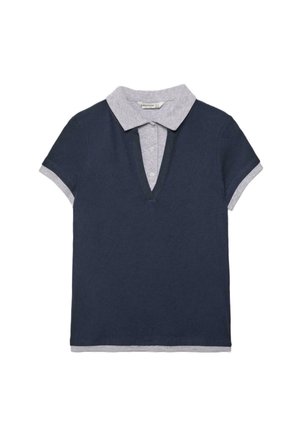 Short-sleeve navy blue polo shirt layered over a light gray collared shirt with visible buttons and cuffs.