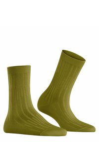 Ein Paar olivgrüne, gerippte Crew-Socken, nebeneinander dargestellt, mit einem strukturierten vertikalen Muster und verstärkten Fußspitzen und Fersen.