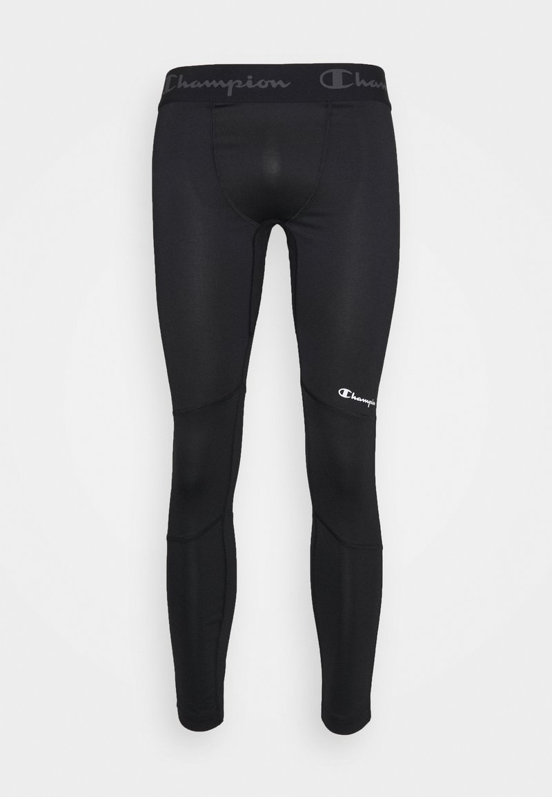 Leggings noirs en tissu extensible, dotés d'une large taille noire avec le logo "Champion" et d'un petit logo blanc sur la cuisse.