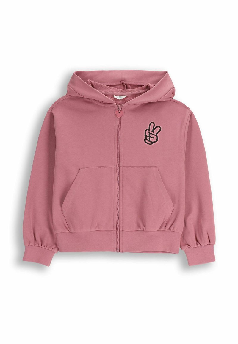 Różowa bluza z kapturem zapinana na zamek, miękki materiał, kieszenie typu kangur, elastyczne mankiety i dół. Na piersi wyhaftowany czarny symbol gestu pokoju dłonią.