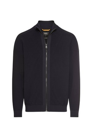Schwarze Zip-Up-Jacke mit hohem Kragen, strukturiertem Strickmuster und gerippten Bündchen. Hat eine kontrastierende Farbe am inneren Kragen.