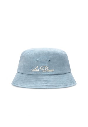 Light blue bucket hat made of suede, featuring embroidered text "Les Deux" in cream. The hat has a wide, flat brim and textured surface.