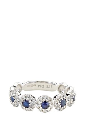 Silver ring featuring alternating round blue sapphires and diamond clusters, textured band with smooth edges, elegant closed design.