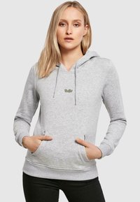 Felpa grigia in cotone con scollatura a V, coulisse, tasca frontale e dettagli del logo discreti sul petto, caratterizzata da una texture morbida e polsini attillati.